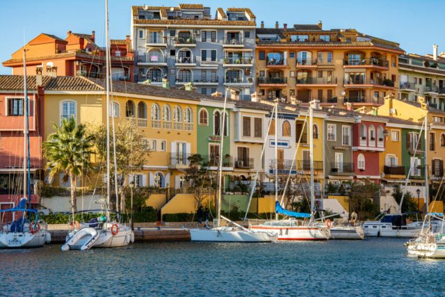 "Port Sa Playa, Valencia, Spain - 12/08/2021: Bright sunny day panoramic photo looking at Port Saplaya, Valencia's Little Venice"